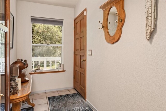 36556 Mudge Ranch Rd, Coarsegold, CA 93614 - doorway to outside featuring light tile patterned flooring and a wealth of natural light