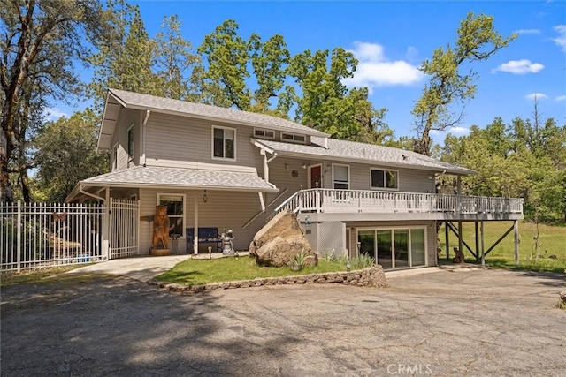 36556 Mudge Ranch Rd, Coarsegold, CA 93614 - back of house with fence, a wooden deck, stairs, and a patio area