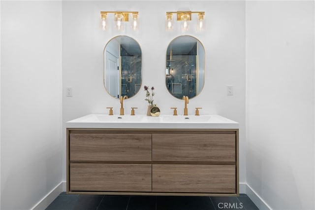 6316 Michelson St, Lakewood, CA 90713 - bathroom with tile patterned flooring, a sink, baseboards, and double vanity