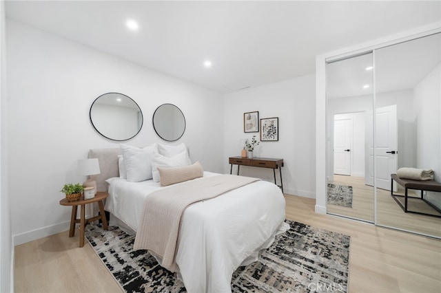 6316 Michelson St, Lakewood, CA 90713 - bedroom featuring a closet, recessed lighting, light wood finished floors, and baseboards