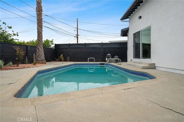 6316 Michelson St, Lakewood, CA 90713 - view of pool with entry steps, a fenced in pool, a fenced backyard, and a patio area