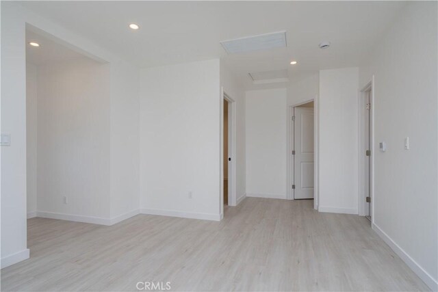 16737 E Greenhaven St, Covina, CA 91722 - spare room featuring light wood-type flooring, attic access, baseboards, and recessed lighting