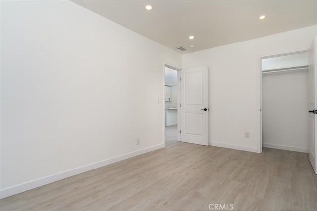 16737 E Greenhaven St, Covina, CA 91722 - unfurnished bedroom featuring light wood-style floors, recessed lighting, baseboards, a spacious closet, and a closet