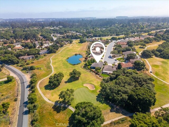 aerial view with a residential view, a water view, and golf course view