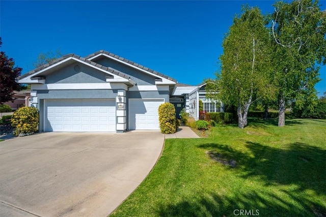 ranch-style house featuring a front lawn, stucco siding, an attached garage, driveway, and a tile roof