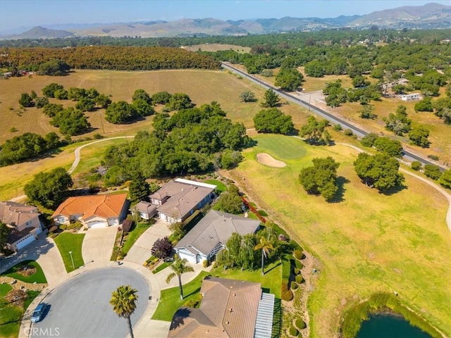 birds eye view of property featuring a mountain view