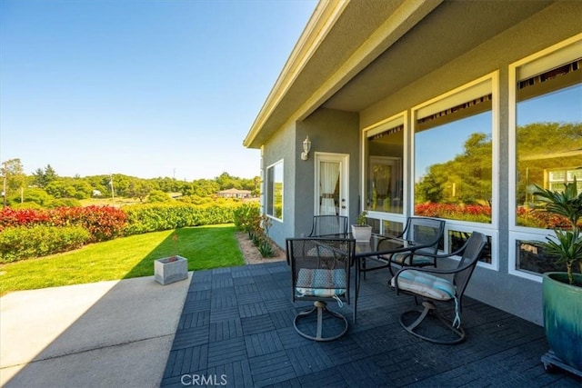 view of patio with outdoor dining area