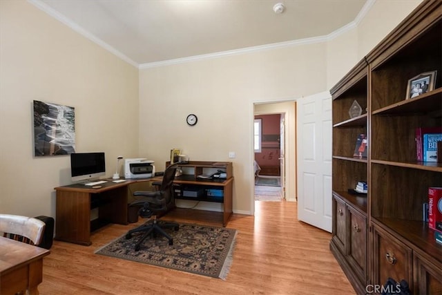 office with ornamental molding and light wood finished floors
