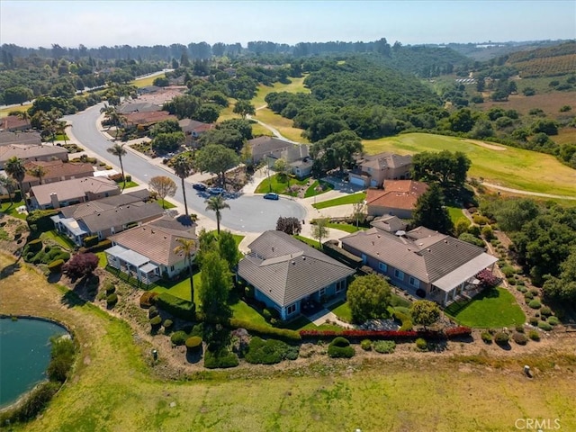 bird's eye view featuring a water view and a residential view