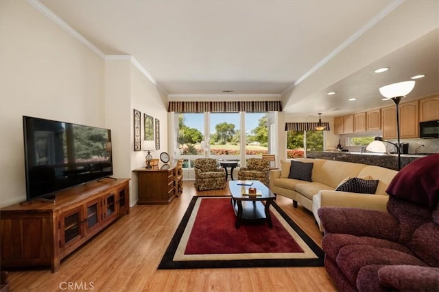 living room with recessed lighting, ornamental molding, and light wood-style floors