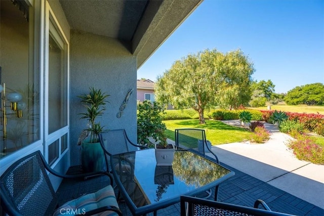view of patio featuring outdoor dining area