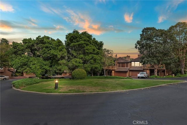 672 Serrano Dr Unit 9, San Luis Obispo, CA 93405 - obstructed view of property with a front lawn and asphalt driveway