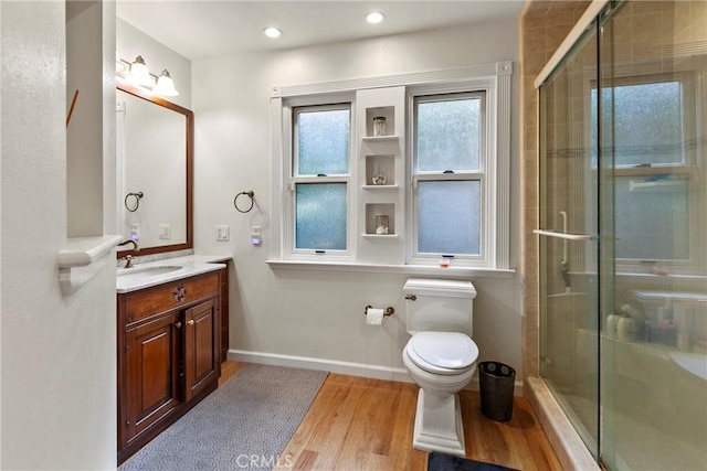 672 Serrano Dr Unit 9, San Luis Obispo, CA 93405 - full bath with wood finished floors, a stall shower, vanity, toilet, and recessed lighting