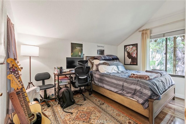 672 Serrano Dr Unit 9, San Luis Obispo, CA 93405 - bedroom with vaulted ceiling, wood finished floors, and baseboards