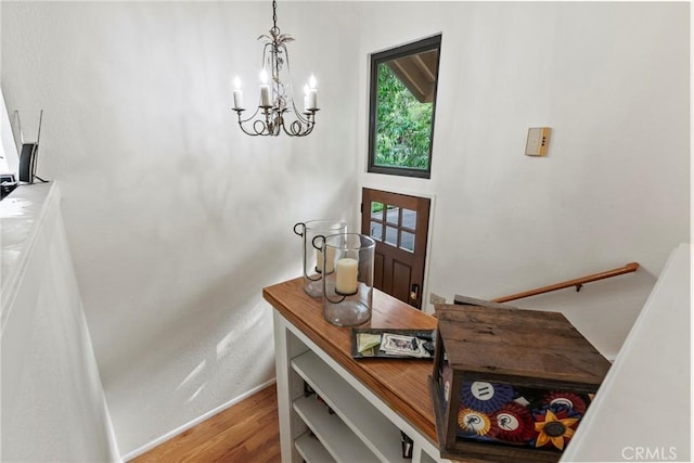672 Serrano Dr Unit 9, San Luis Obispo, CA 93405 - entrance foyer with a chandelier, wood finished floors, and baseboards