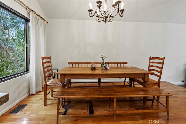 672 Serrano Dr Unit 9, San Luis Obispo, CA 93405 - dining area featuring light wood-style flooring, a chandelier, lofted ceiling, and baseboards