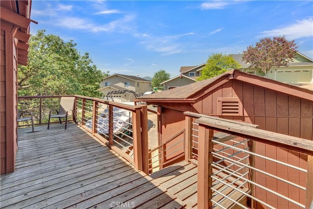 wooden deck featuring a residential view
