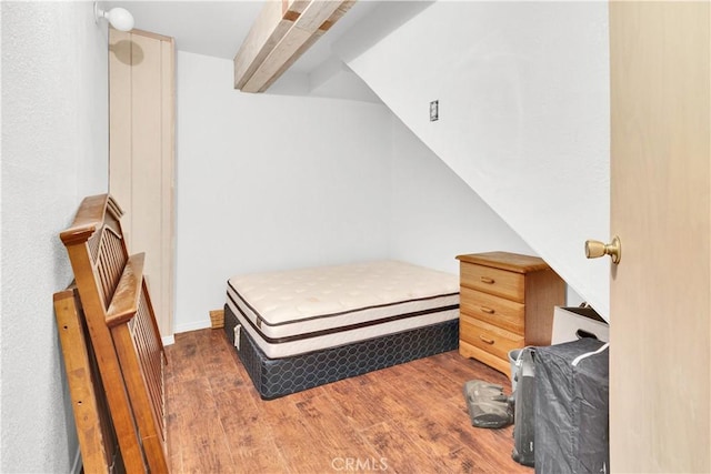 bedroom with wood finished floors