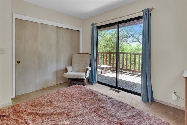 interior space featuring baseboards, visible vents, and carpet
