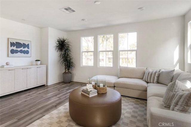 15216 Janine Dr Unit 7, Whittier, CA 90605 - living room featuring baseboards, light wood-style floors, a healthy amount of sunlight, and visible vents