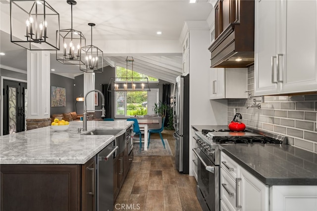 324 W S Ave, Redlands, CA 92373 - kitchen with stainless steel appliances, custom range hood, dark wood-style flooring, a chandelier, and dark brown cabinetry