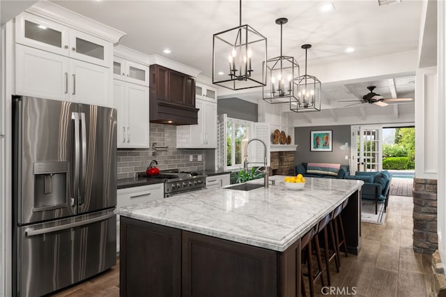 324 W S Ave, Redlands, CA 92373 - kitchen with stainless steel appliances, dark wood-style floors, plenty of natural light, tasteful backsplash, and recessed lighting
