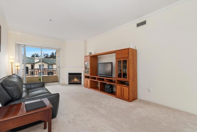 10832 Scripps Ranch Blvd Unit 307, San Diego, CA 92131 - carpeted living area featuring visible vents, a glass covered fireplace, crown molding, and baseboards