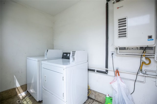 7347 Bakman Ave, Sun Valley, CA 91352 - clothes washing area with water heater and washing machine and dryer