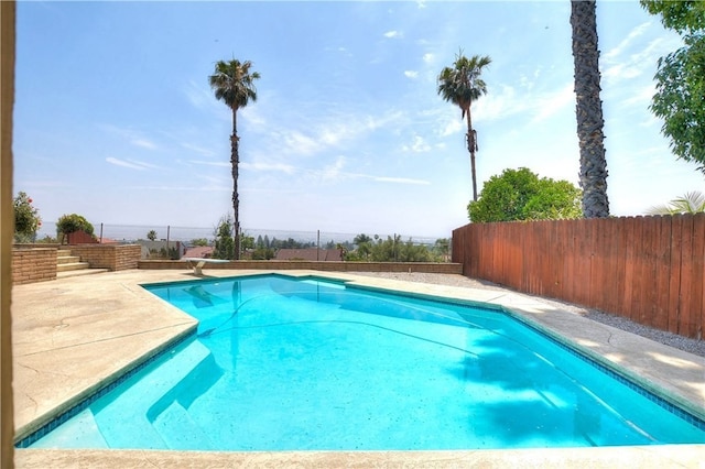 3899 28th St, Highland, CA 92346 - view of swimming pool featuring a fenced backyard