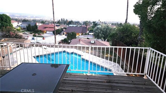 3899 28th St, Highland, CA 92346 - view of swimming pool with fence and a residential view