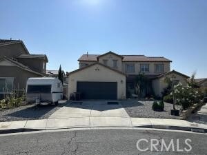 view of front of home with an attached garage and concrete driveway