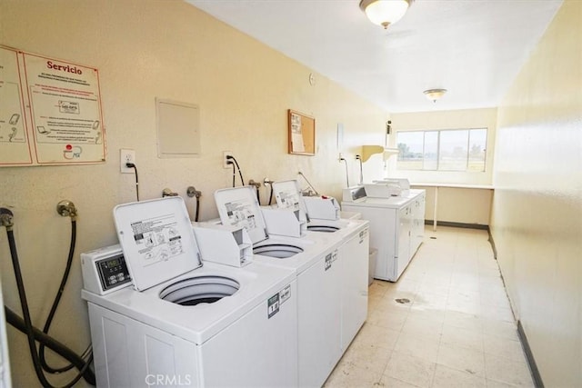 31732 Ridge Route Rd Unit 111, Castaic, CA 91384 - communal laundry room with washing machine and dryer and light flooring