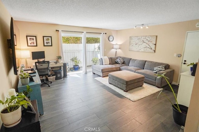31732 Ridge Route Rd Unit 111, Castaic, CA 91384 - living room with dark wood finished floors, an office area, a textured ceiling, and track lighting