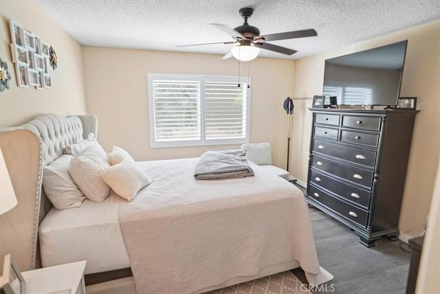 31732 Ridge Route Rd Unit 111, Castaic, CA 91384 - bedroom featuring a textured ceiling, ceiling fan, and wood finished floors