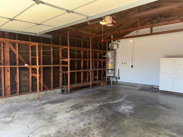 garage with secured water heater and a garage door opener