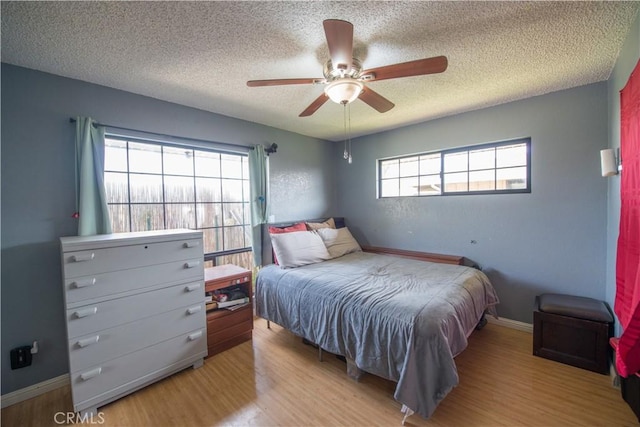 538 Milky Way, Vandenberg Village, CA 93436 - bedroom featuring baseboards, light wood finished floors, and a textured ceiling