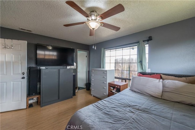 538 Milky Way, Vandenberg Village, CA 93436 - bedroom with a ceiling fan, visible vents, a textured ceiling, and wood finished floors