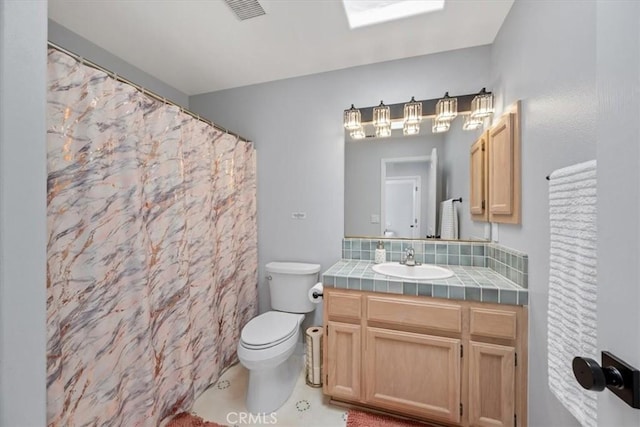 317 Alder St, Arroyo Grande, CA 93420 - full bathroom featuring vanity, backsplash, toilet, and visible vents