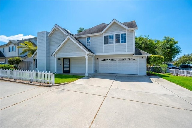 317 Alder St, Arroyo Grande, CA 93420 - view of front facade with concrete driveway, an attached garage, fence, and a front lawn
