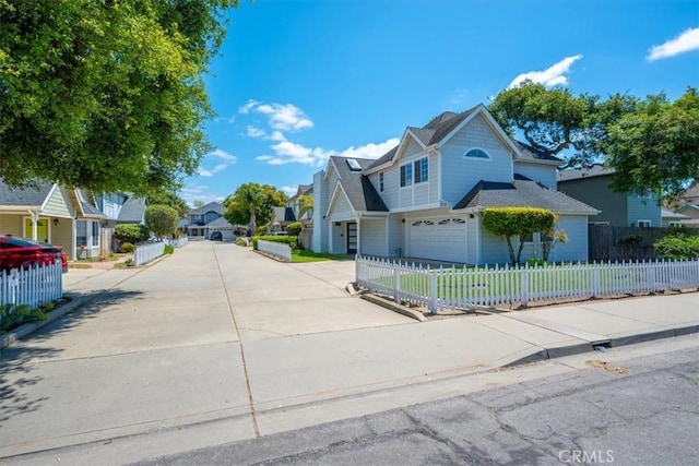 317 Alder St, Arroyo Grande, CA 93420 - view of front of property featuring concrete driveway, an attached garage, a residential view, and a fenced front yard