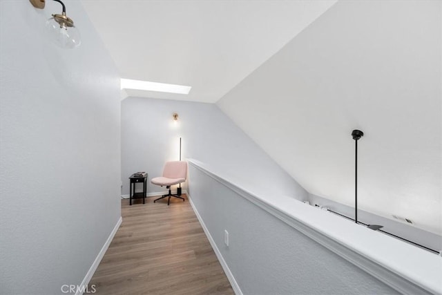 317 Alder St, Arroyo Grande, CA 93420 - corridor featuring baseboards, lofted ceiling with skylight, and wood finished floors