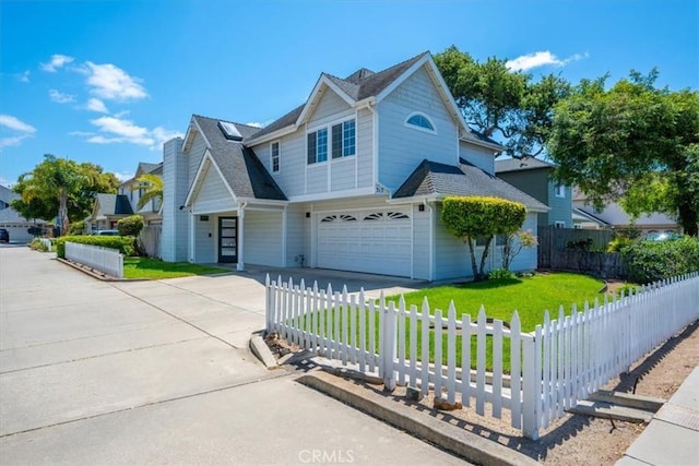 317 Alder St, Arroyo Grande, CA 93420 - traditional home featuring concrete driveway, an attached garage, a fenced front yard, and a front yard