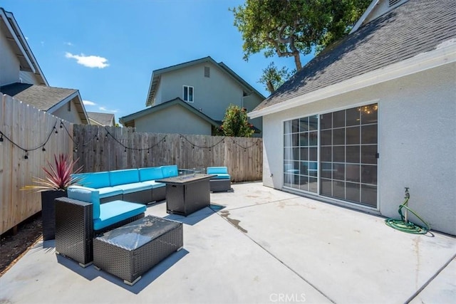 317 Alder St, Arroyo Grande, CA 93420 - view of patio featuring a fenced backyard and an outdoor living space with a fire pit
