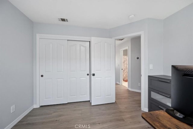 317 Alder St, Arroyo Grande, CA 93420 - unfurnished office featuring visible vents, baseboards, and wood finished floors