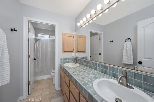 317 Alder St, Arroyo Grande, CA 93420 - bathroom with double vanity, toilet, curtained shower, and a sink