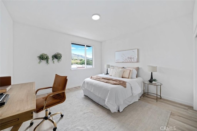 2475 Victoria Ave Unit 410, San Luis Obispo, CA 93401 - bedroom featuring baseboards and wood finished floors