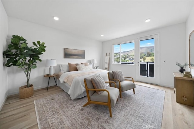 2475 Victoria Ave Unit 410, San Luis Obispo, CA 93401 - bedroom featuring access to outside, light wood-type flooring, baseboards, and recessed lighting
