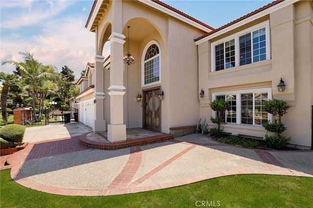 20454 Sartell Dr, Walnut, CA 91789 - entrance to property featuring a garage, stucco siding, driveway, and a gate
