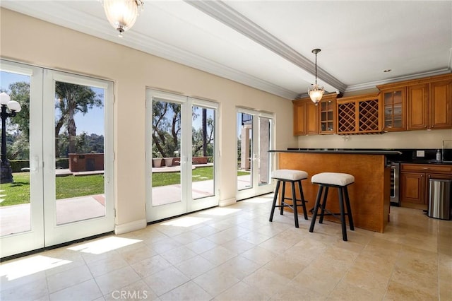 20454 Sartell Dr, Walnut, CA 91789 - bar with light tile patterned flooring, hanging light fixtures, french doors, wet bar, and ornamental molding