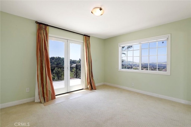 20454 Sartell Dr, Walnut, CA 91789 - carpeted spare room featuring baseboards, french doors, and a healthy amount of sunlight